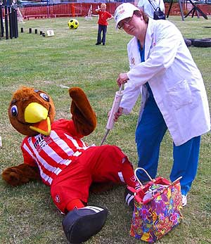 Angela attending to the 'injured' mascots at Milton Kenynes